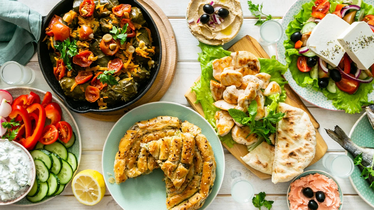 Traditional Greek dishes (Greek salad, spanakopita, fish, pita breads, tzatziki etc.)